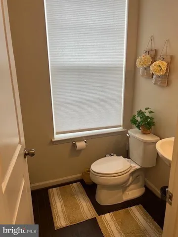 an empty room with wooden floor