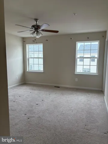 a bathroom with a double vanity sink toilet and mirror
