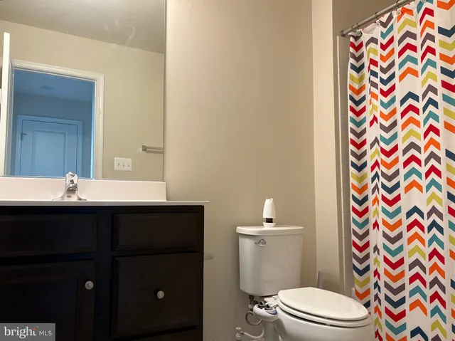 a balcony view with couple of chairs in front of door