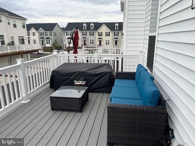 a view of a balcony with furniture