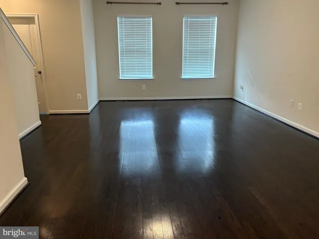 an empty room with wooden floor