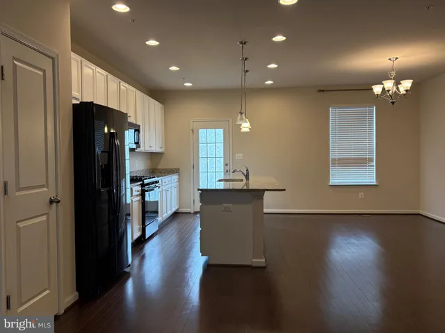 a bathroom with a toilet and a shower curtain
