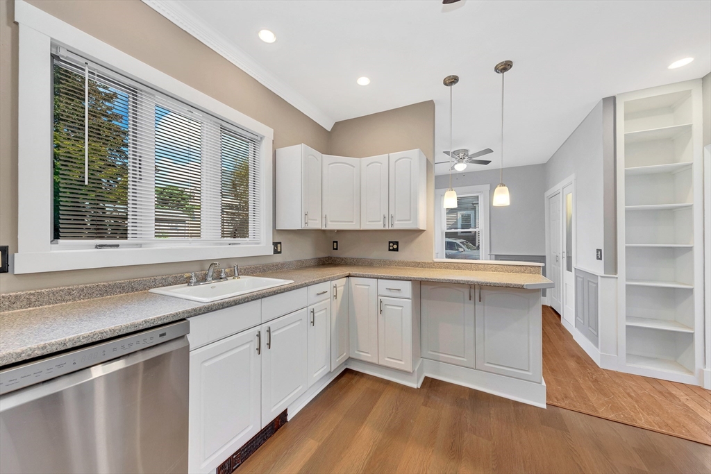 24 Taylor Street, Unit 1 Gloucester, MA 01930 - Photo 14 of 29 a kitchen with a sink cabinets and window