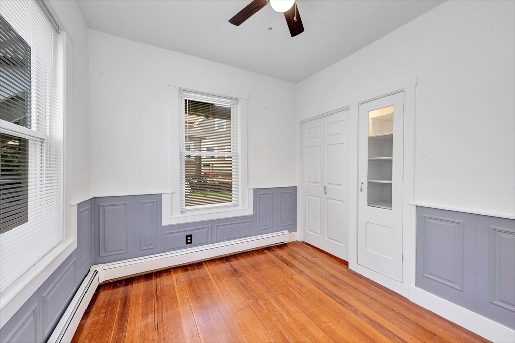24 Taylor Street, Unit 1 Gloucester, MA 01930 - Photo 18 of 29 a view of a room with wooden floor and window
