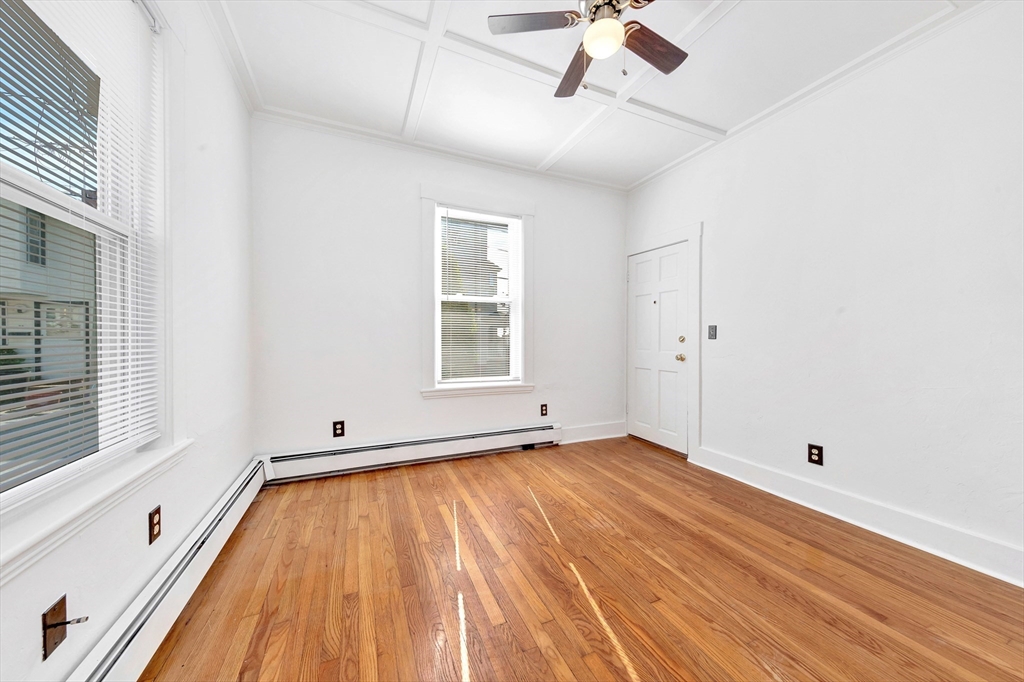 24 Taylor Street, Unit 1 Gloucester, MA 01930 - Photo 22 of 29 a view of room with window and wooden floor