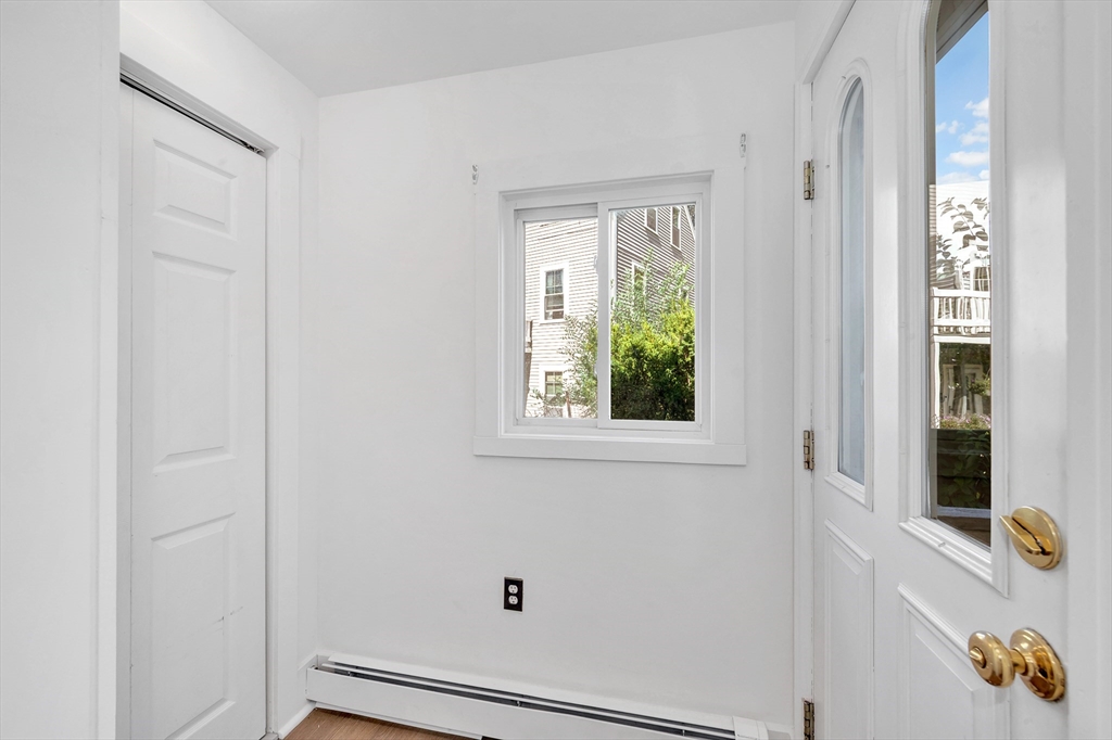 24 Taylor Street, Unit 1 Gloucester, MA 01930 - Photo 24 of 29 a view of an entryway with wooden floor
