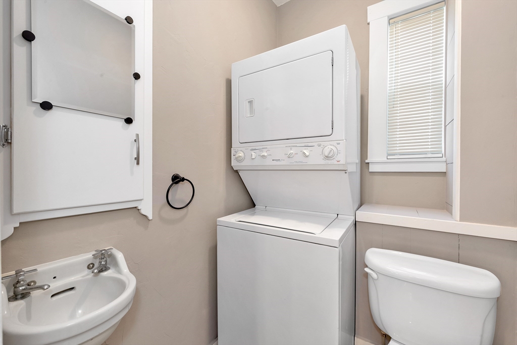 24 Taylor Street, Unit 1 Gloucester, MA 01930 - Photo 25 of 29 a bathroom with a toilet sink and mirror