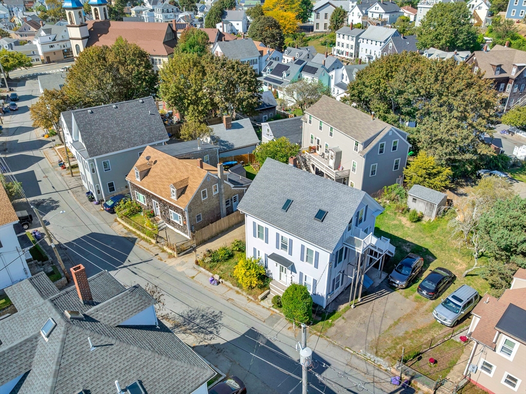 24 Taylor Street, Unit 1 Gloucester, MA 01930 - Photo 4 of 29 an aerial view of a house with outdoor space
