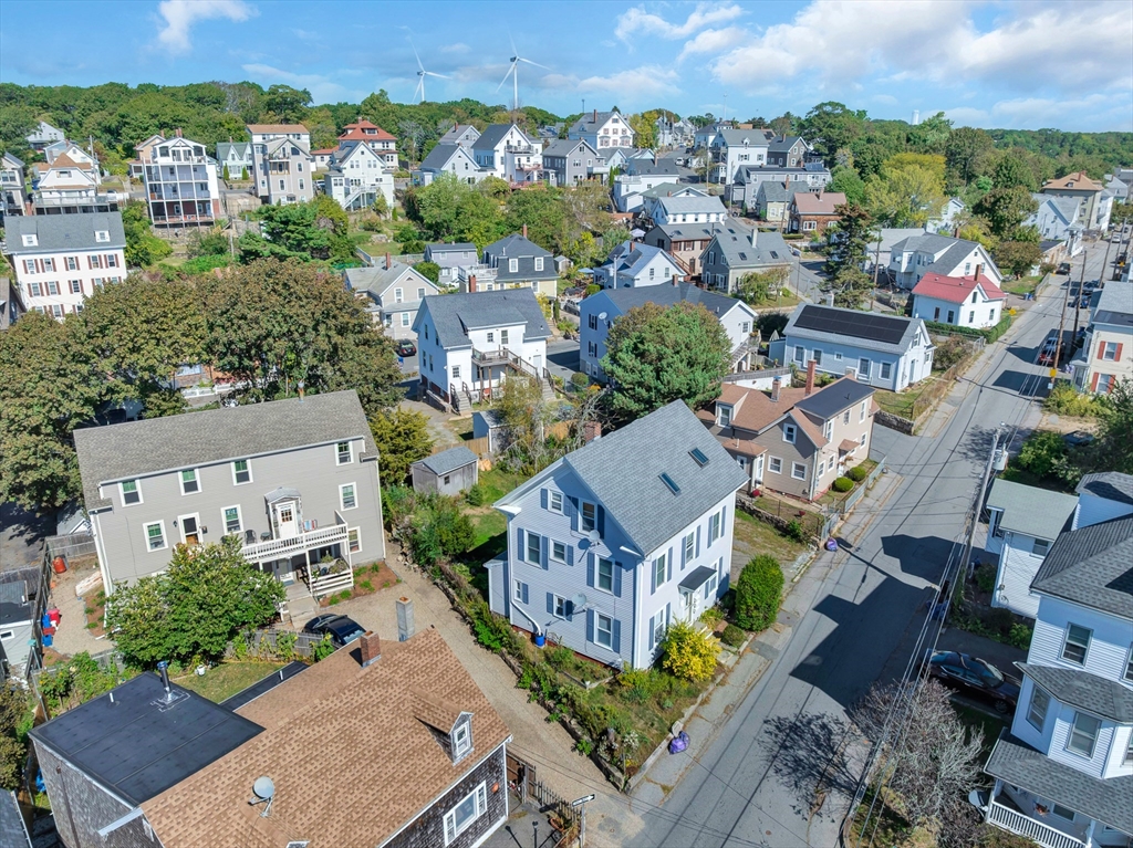 24 Taylor Street, Unit 1 Gloucester, MA 01930 - Photo 5 of 29 an aerial view of a house with a garden