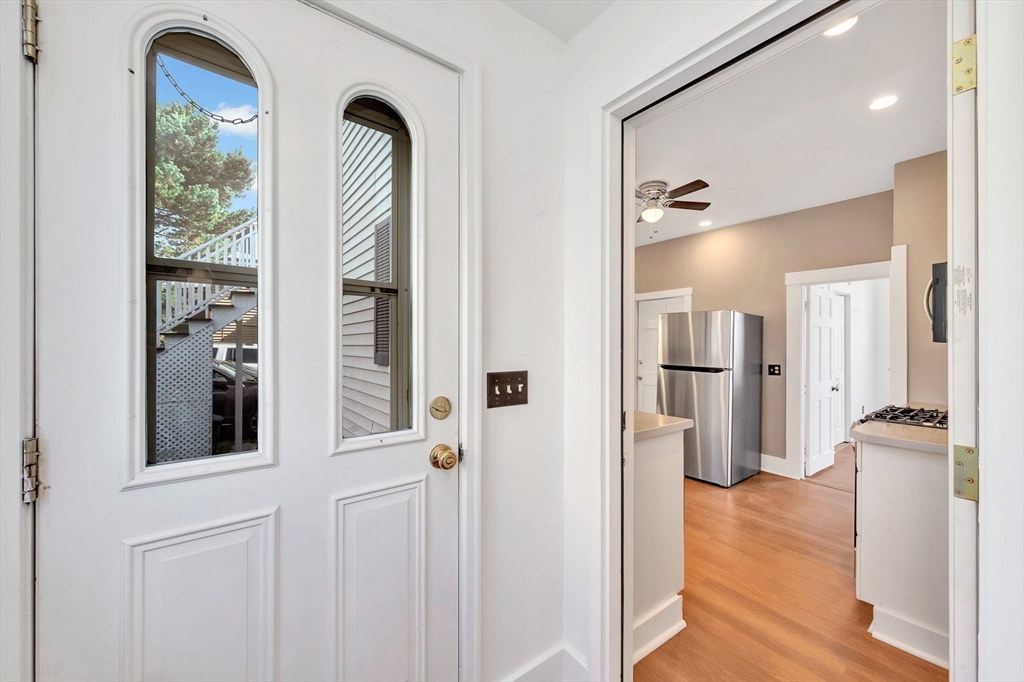 24 Taylor Street, Unit 1 Gloucester, MA 01930 - Photo 9 of 29 a view of livingroom with hardwood floor and hallway