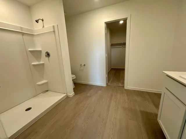 a view of a bathroom with a tub and shower