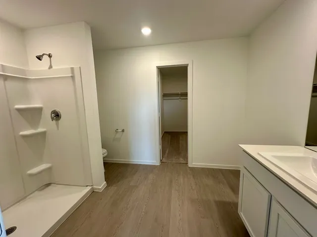 a view of hallway with wooden floor