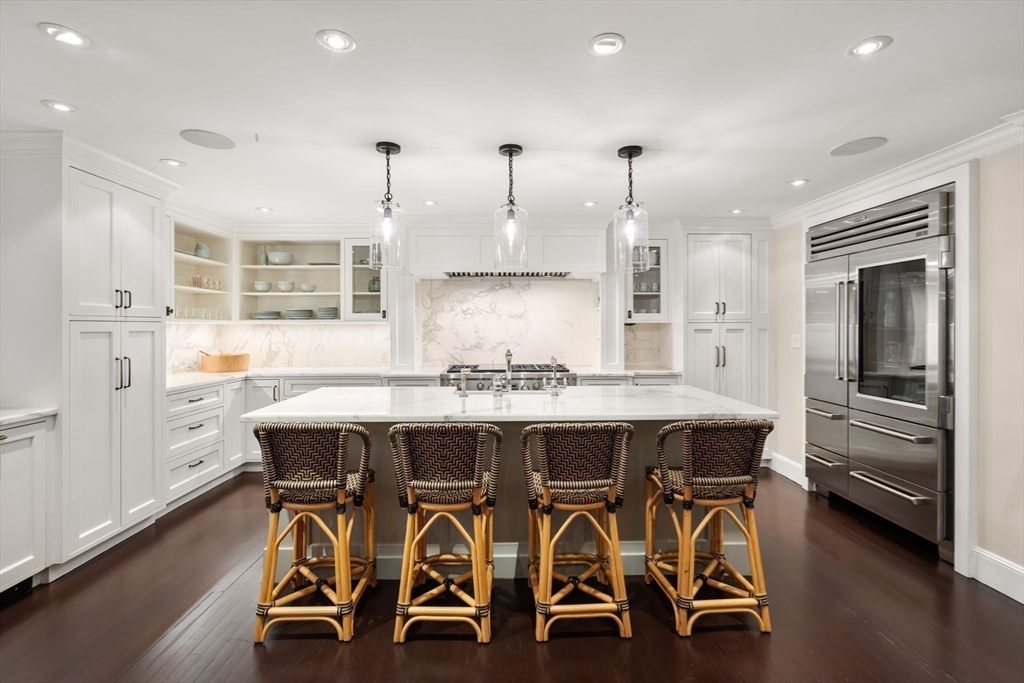 48 Scotch Pine Road Wellesley, MA 02481 - Photo 6 of 39 a large kitchen with a table and chairs