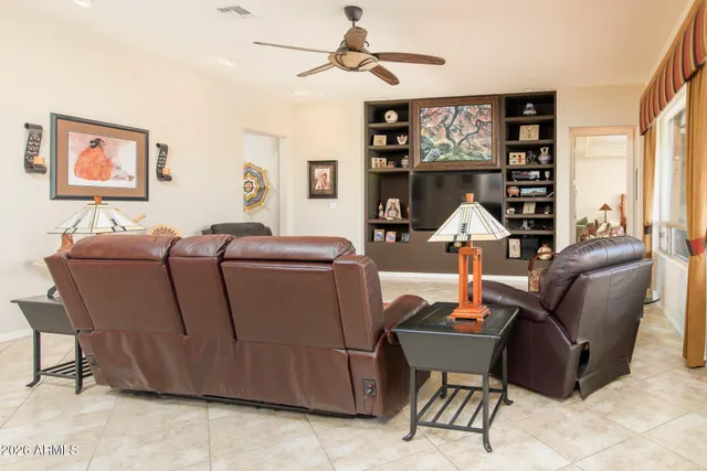 a view of walk in closet with clothes