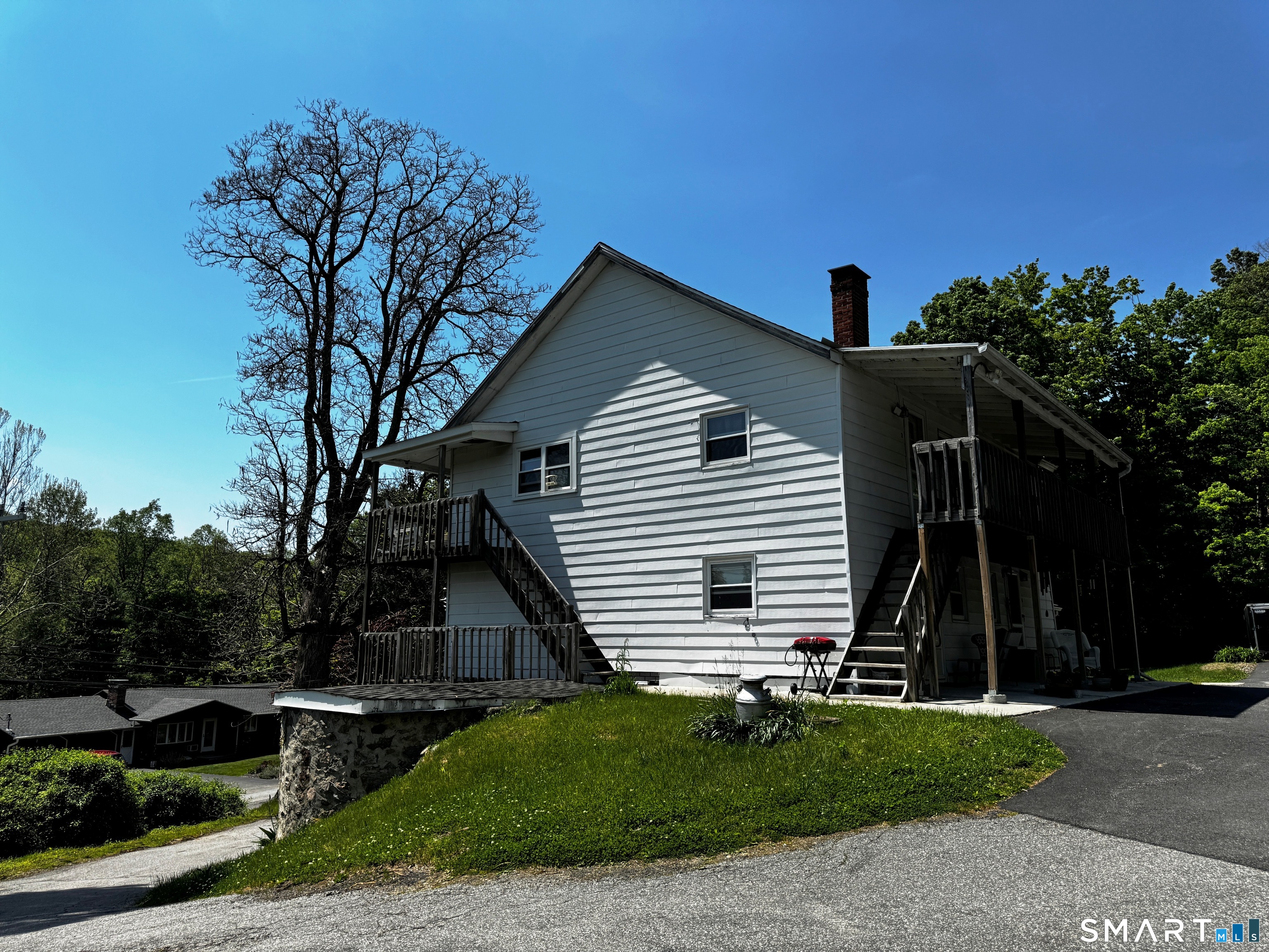 205 Old New Hartford Road Winchester, CT 06098 - Photo 4 of 7 a front view of a house with a garden