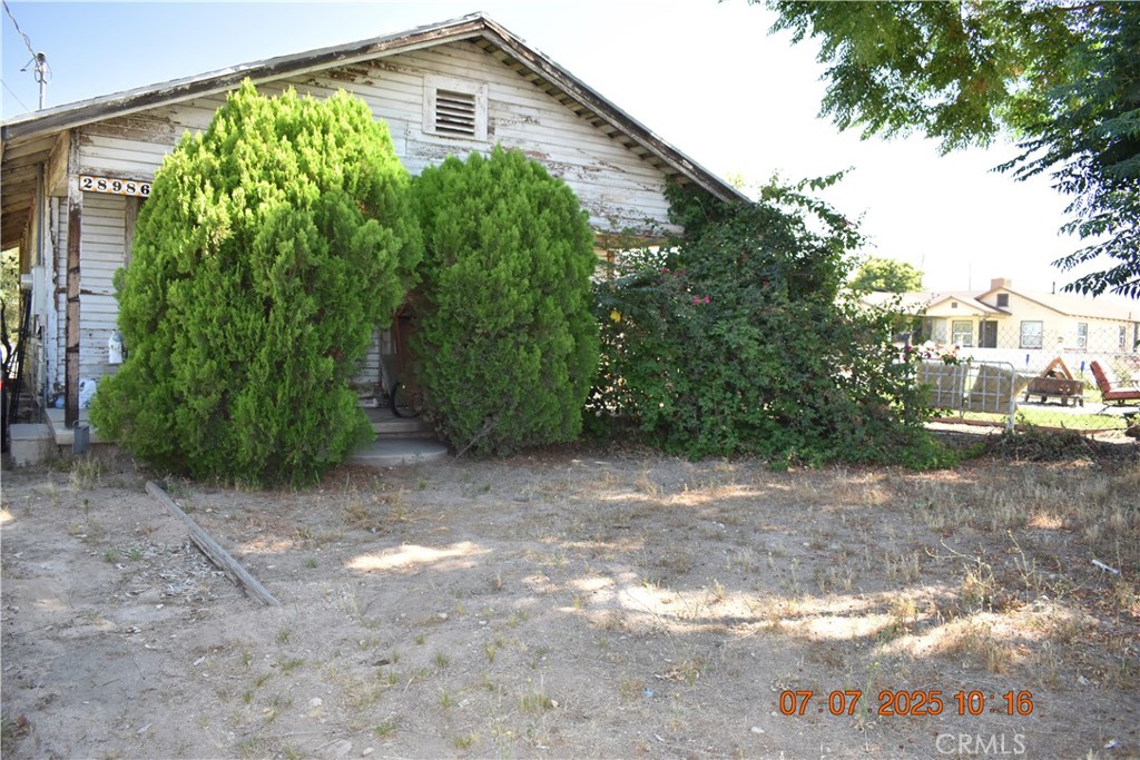 28986 Merris Street Highland, CA 92346 - Photo 2 of 6 a view of a backyard with plants