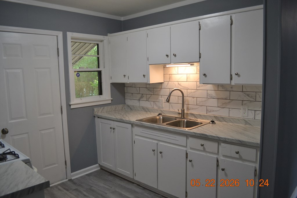 5552 Valleybrook Road Columbus, GA 31907 - Photo 5 of 27 a kitchen with a sink and cabinets