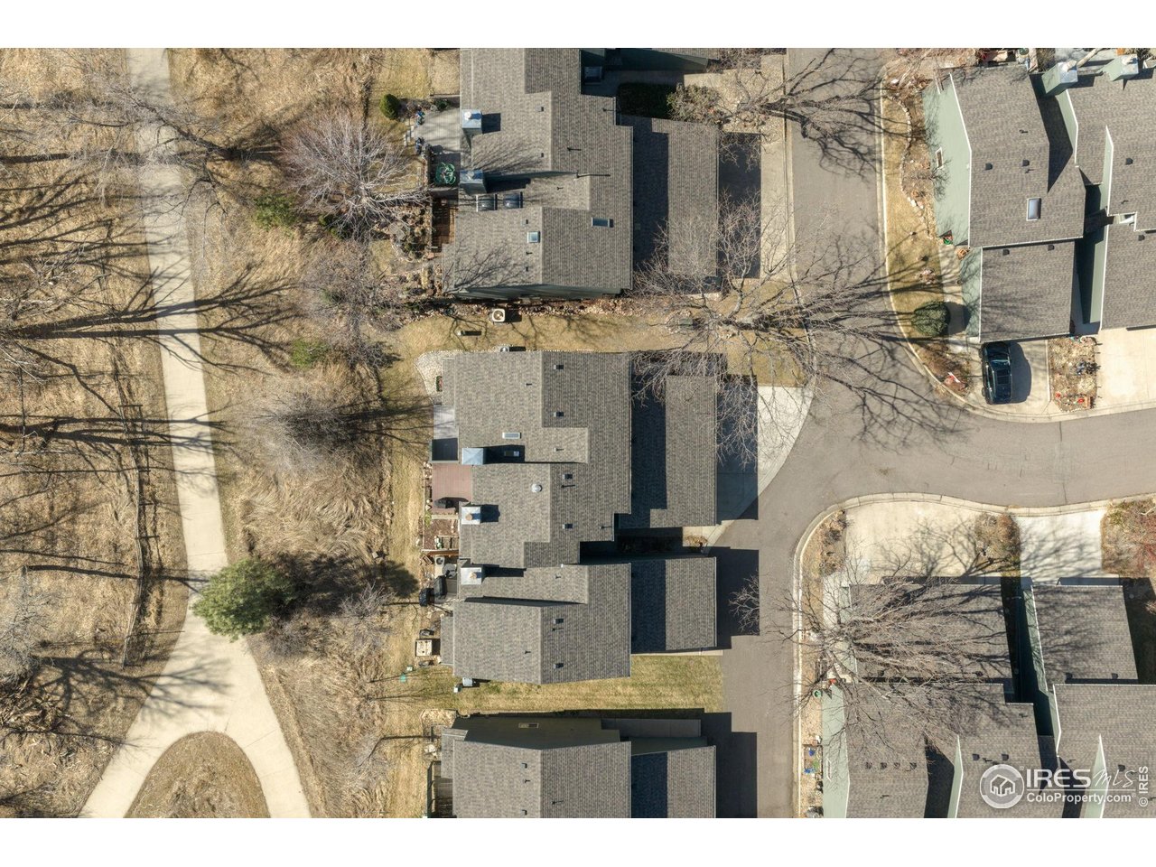 a aerial view of residential houses with outdoor space