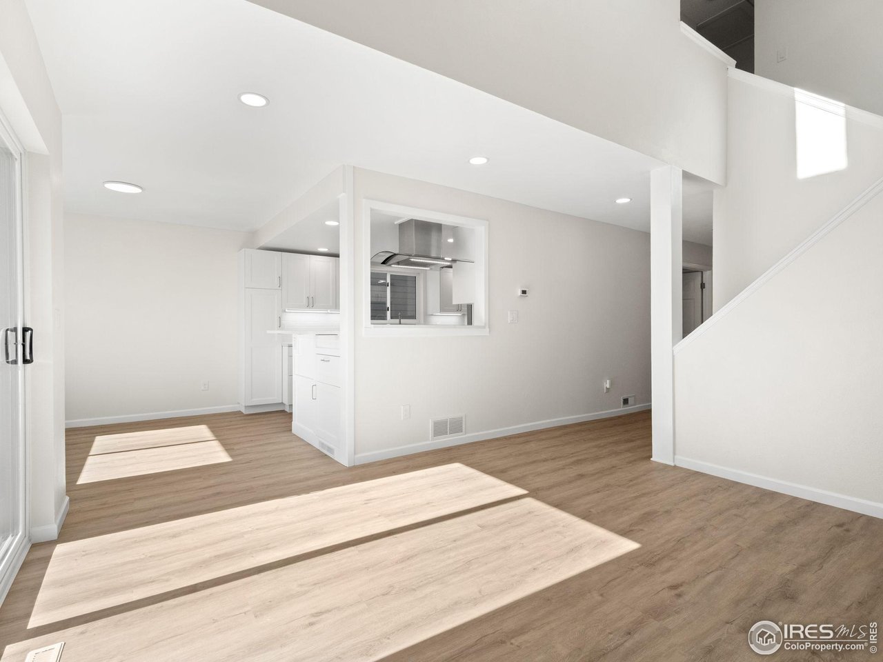 4258 Corriente Place Boulder, CO 80301 - Photo 11 of 37 a view of a kitchen with wooden floor and windows