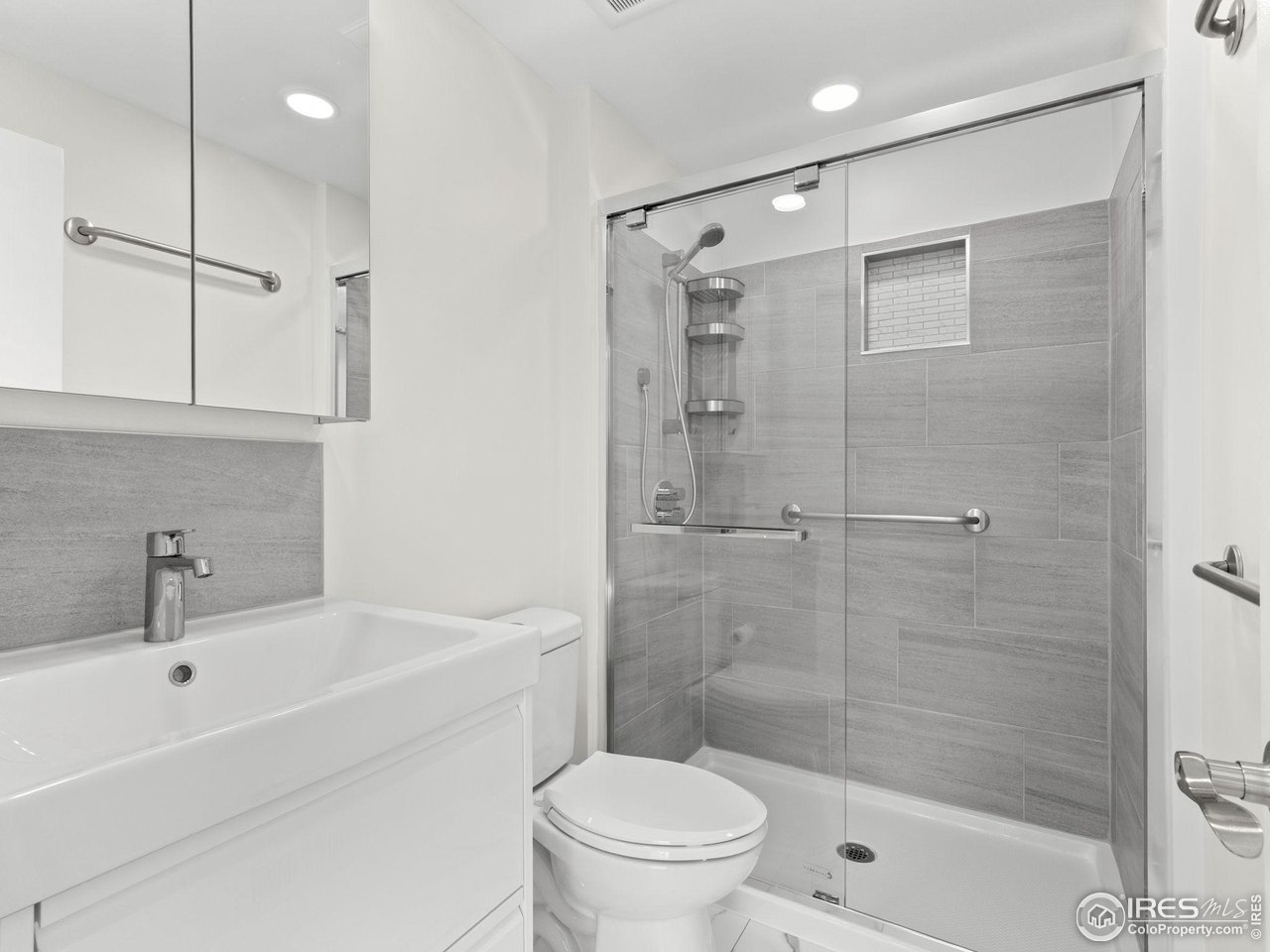 4258 Corriente Place Boulder, CO 80301 - Photo 13 of 37 a bathroom with a shower a toilet and sink