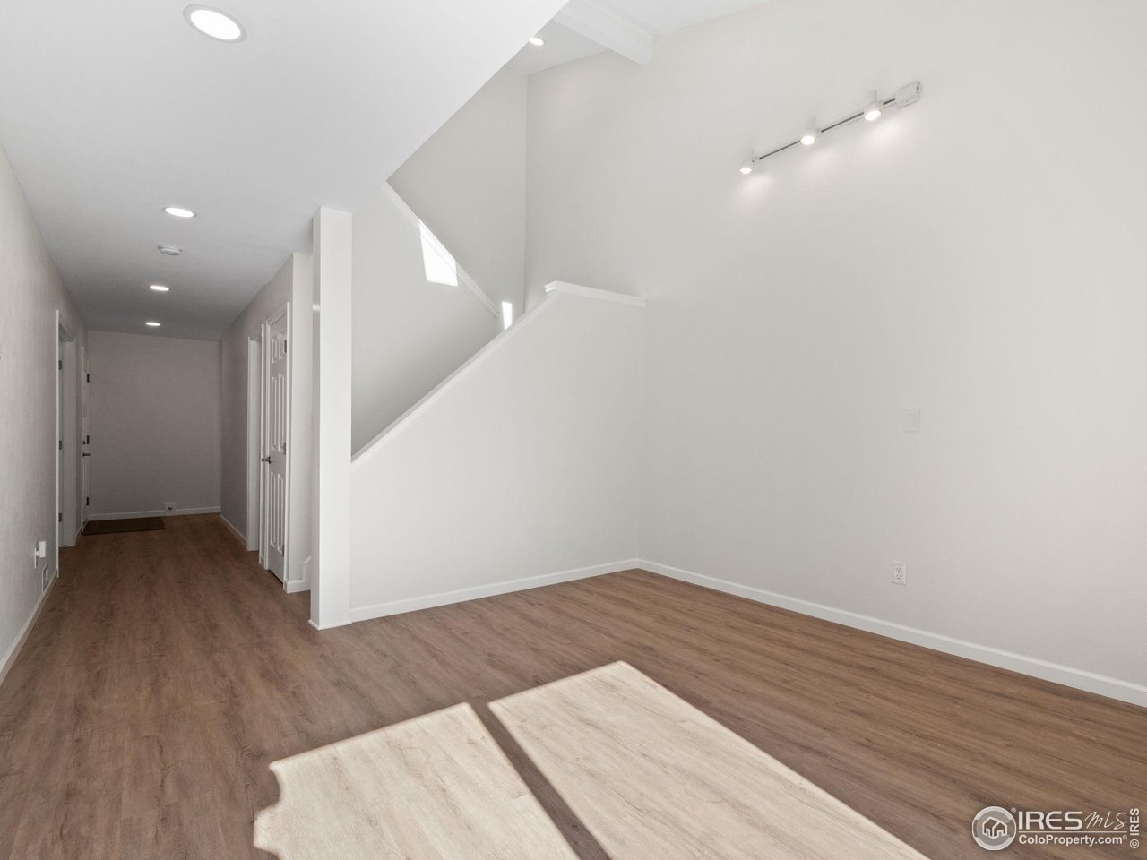 4258 Corriente Place Boulder, CO 80301 - Photo 14 of 37 wooden floor in an empty room with a window
