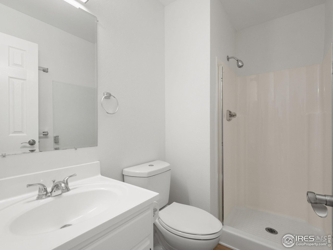 4258 Corriente Place Boulder, CO 80301 - Photo 20 of 37 a bathroom with a sink a toilet and shower