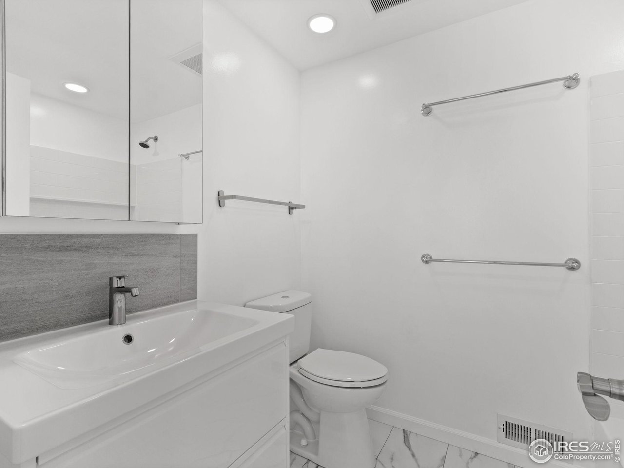 4258 Corriente Place Boulder, CO 80301 - Photo 22 of 37 a bathroom with a sink a toilet and shower