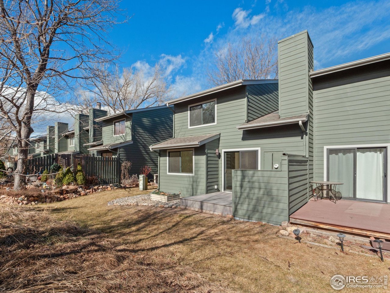 4258 Corriente Place Boulder, CO 80301 - Photo 30 of 37 a backyard of a house with yard and outdoor seating