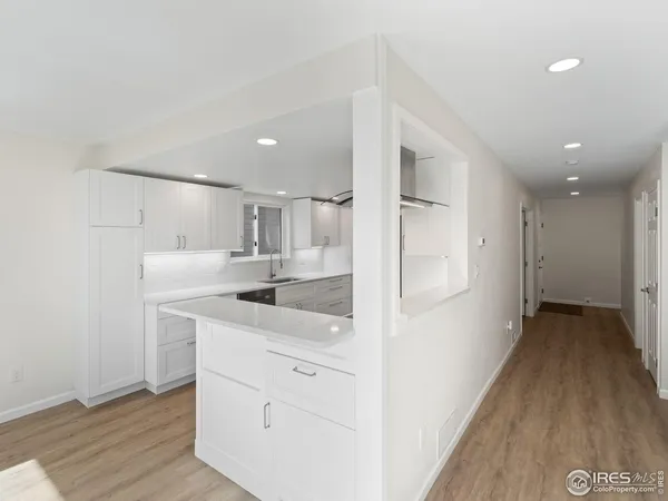 a kitchen with a sink and refrigerator
