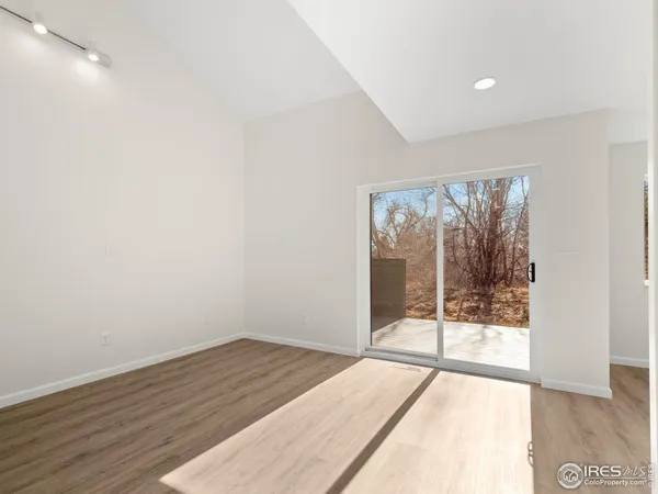 a view of an empty room and window