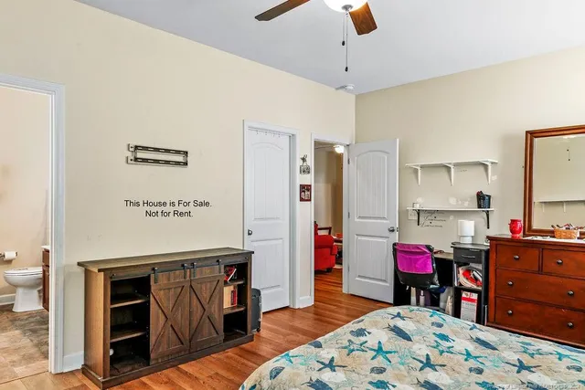 a bedroom with furniture and a dresser
