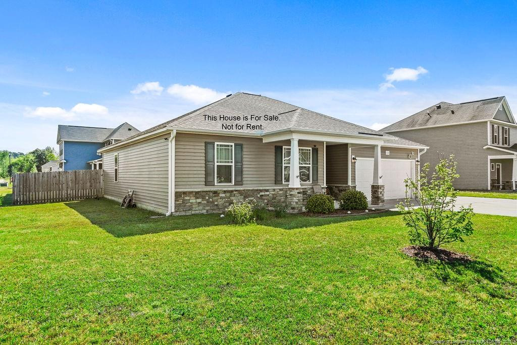 113 Meherrin Loop Raeford, NC 28376 - Photo 4 of 27 a front view of house with yard and green space