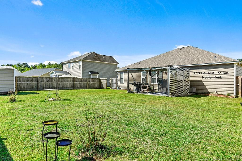 113 Meherrin Loop Raeford, NC 28376 - Photo 6 of 27 a front view of a house with a garden