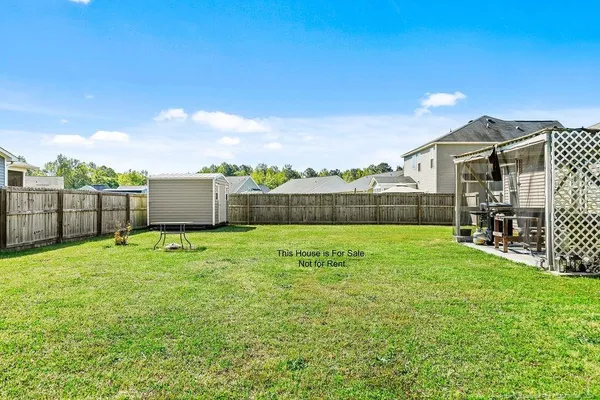 a view of backyard with green space