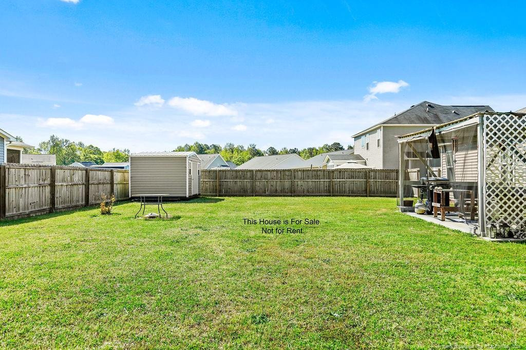 113 Meherrin Loop Raeford, NC 28376 - Photo 7 of 27 a view of backyard with green space