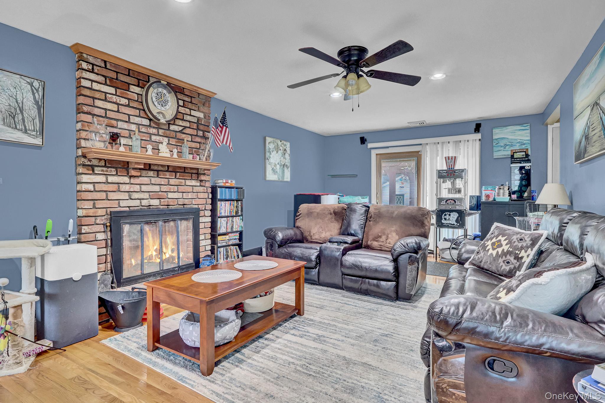 98 Granny Road Farmingville, NY 11738 - Photo 9 of 24 a living room with furniture a fireplace