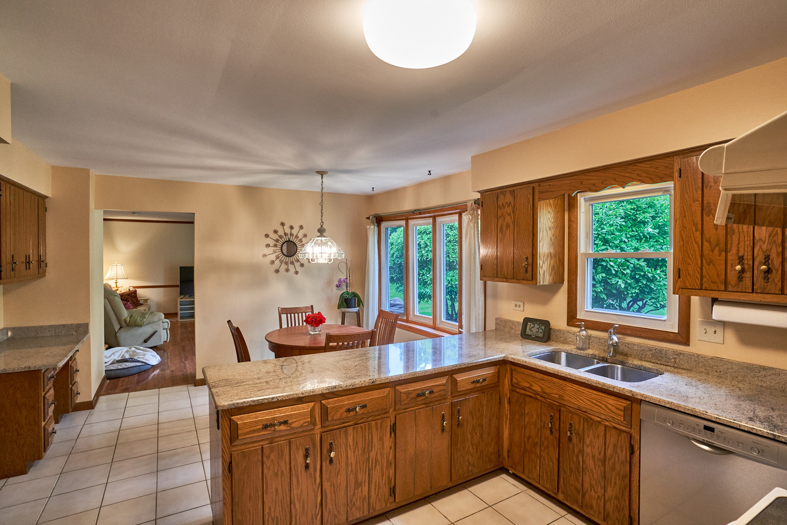 2844 Sun Valley Road Lisle, IL 60532 - Photo 5 of 32 a kitchen with a sink and large windows