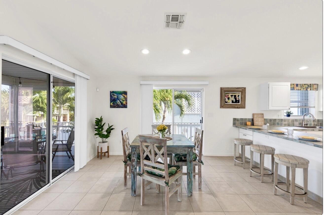 157 Mars Lane Key West, FL 33040 - Photo 13 of 41 a dining room with furniture and window