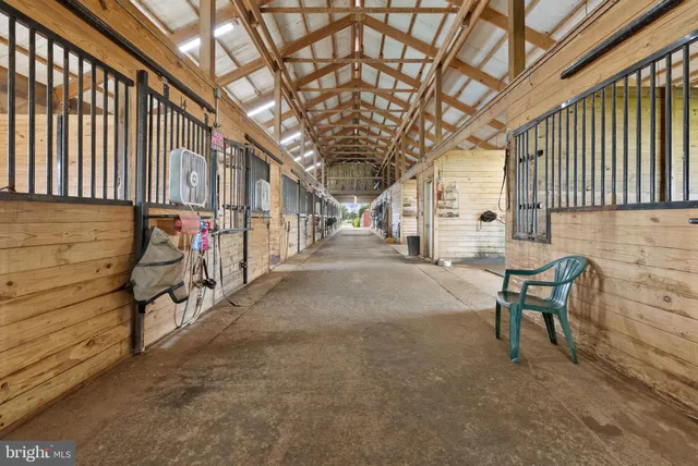 a view of water heater room with wooden floor
