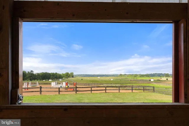 a view of a house with a yard porch and sitting area