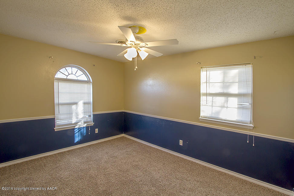4314 Crockett Street Amarillo, TX 79110 - Photo 13 of 21 a view of an empty room with a window