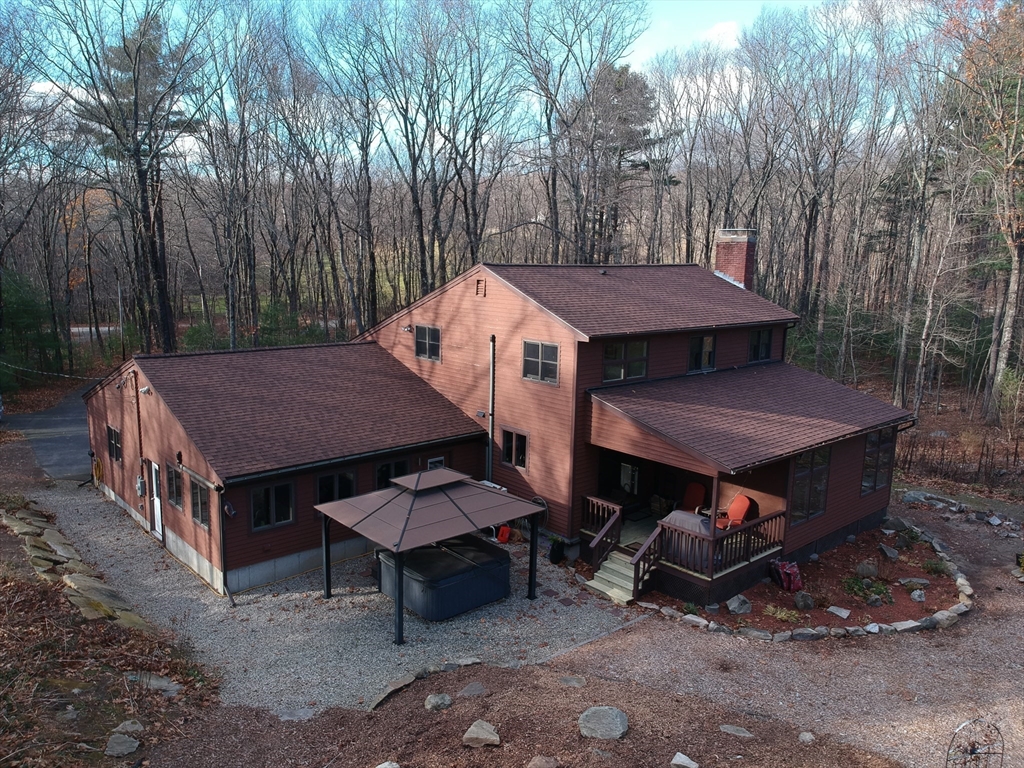 30 Southwick Road Sutton, MA 01590 - Photo 1 of 27 a backyard of a house with table and chairs