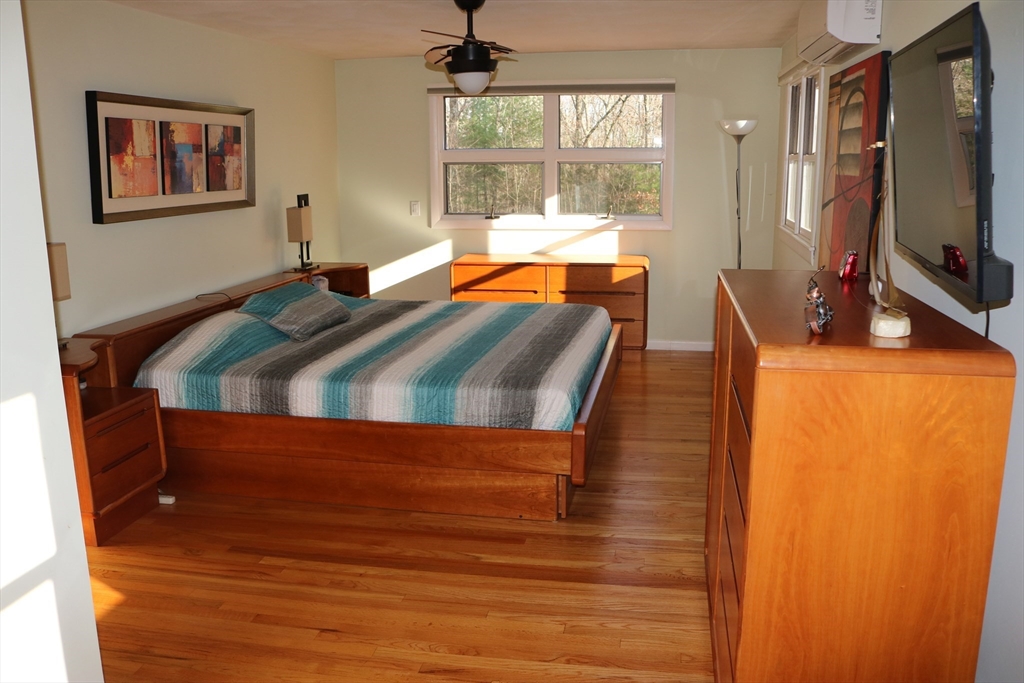 30 Southwick Road Sutton, MA 01590 - Photo 19 of 27 a bedroom with furniture and flat screen tv