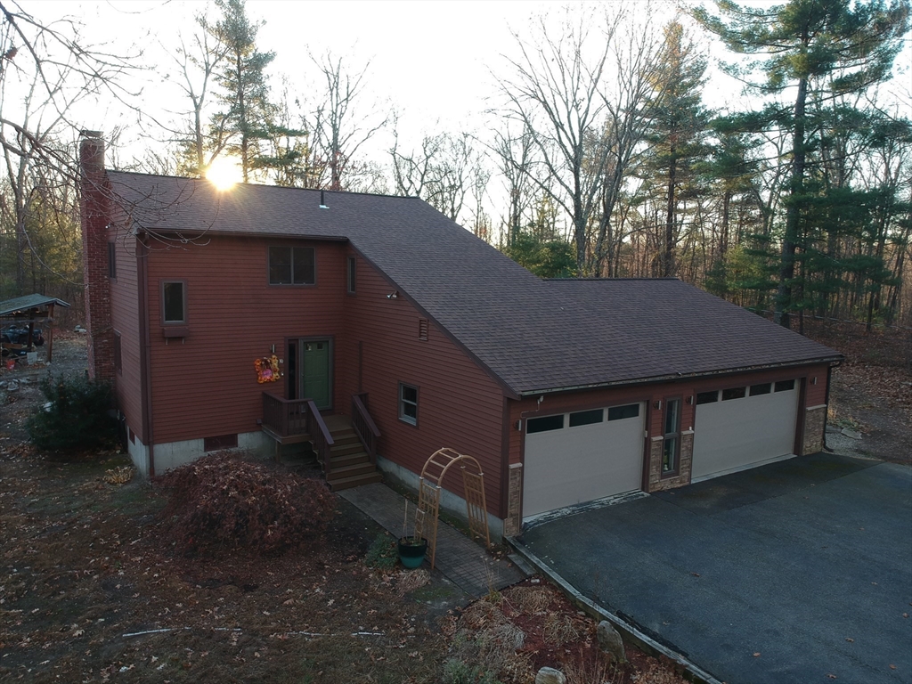 30 Southwick Road Sutton, MA 01590 - Photo 3 of 27 a aerial view of a house with a yard