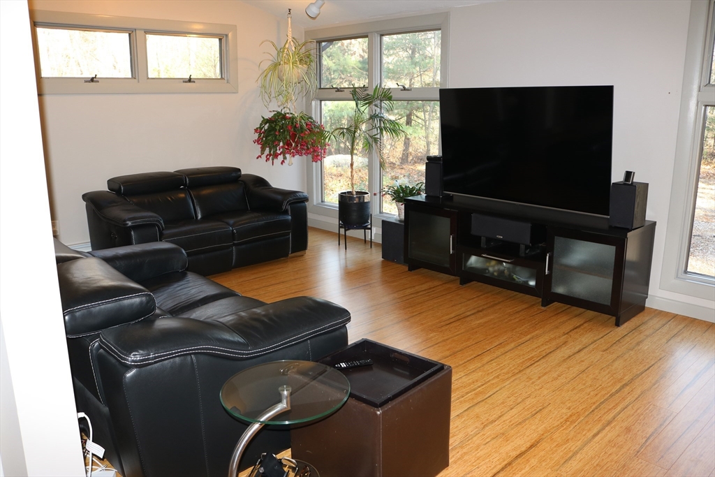 30 Southwick Road Sutton, MA 01590 - Photo 7 of 27 a living room with furniture and a flat screen tv