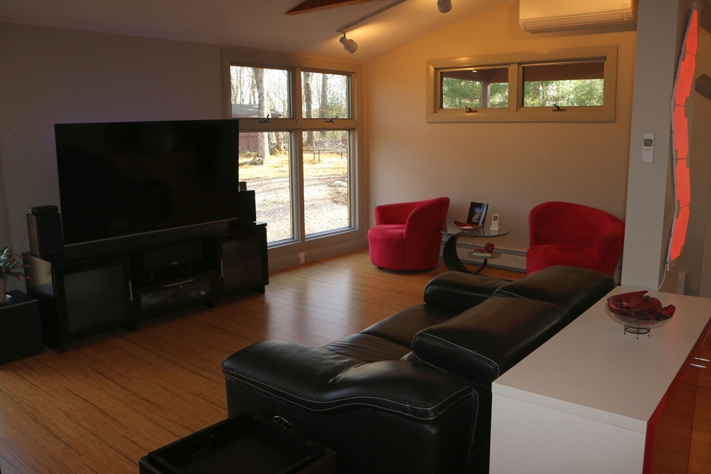 30 Southwick Road Sutton, MA 01590 - Photo 8 of 27 a living room with furniture and a flat screen tv