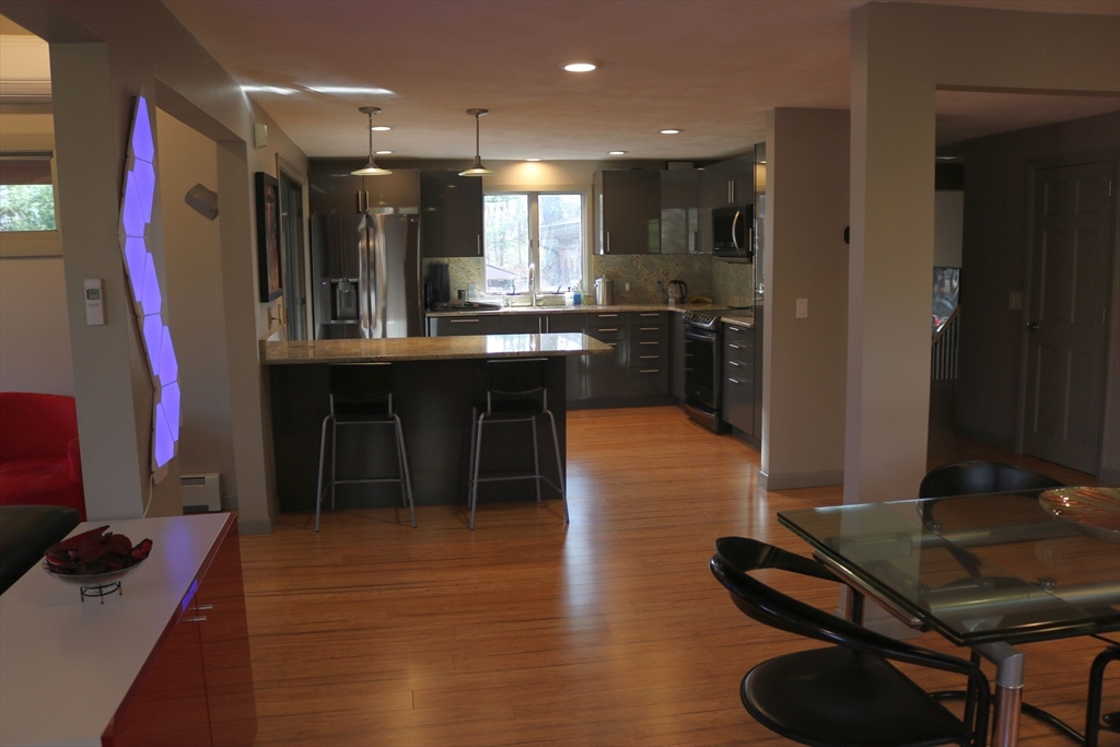 30 Southwick Road Sutton, MA 01590 - Photo 9 of 27 a kitchen with stainless steel appliances granite countertop a refrigerator and a stove top oven