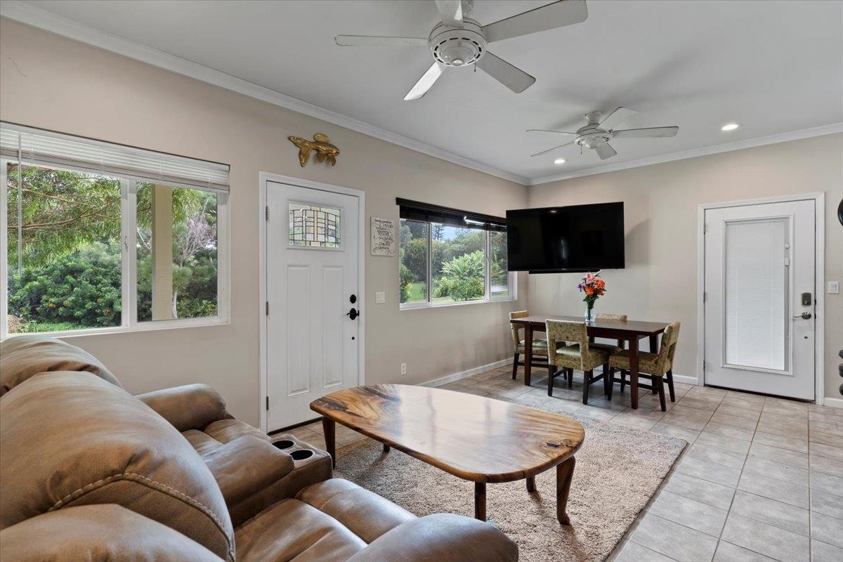 200 Awalau Road, Unit B Haiku, HI 96708 - Photo 18 of 39 a living room with furniture and a flat screen tv