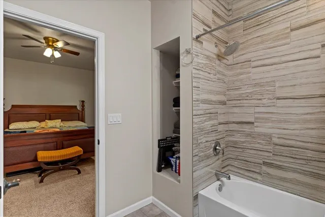 a bathroom with a bathtub and a shower
