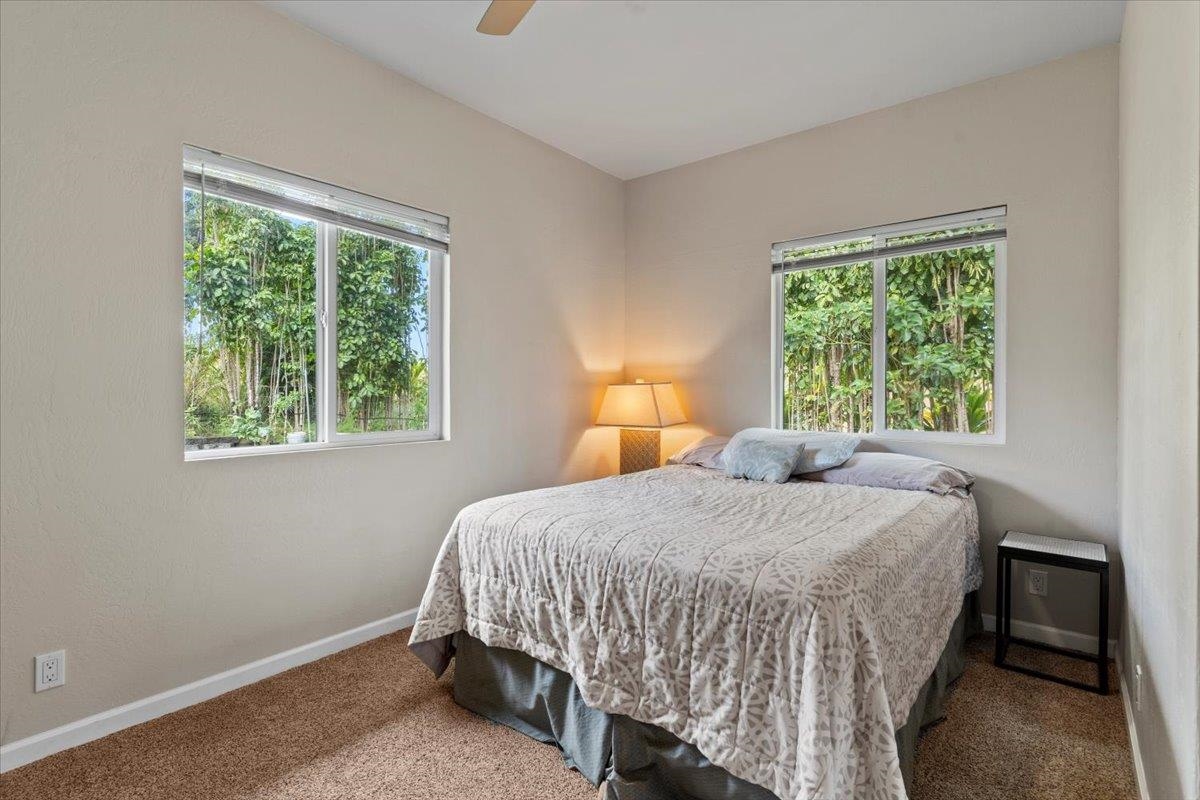 200 Awalau Road, Unit B Haiku, HI 96708 - Photo 9 of 39 a bedroom with a bed and a window